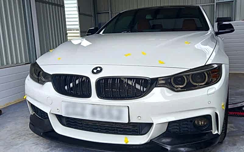 Flawless finish after bumper corner paint repair on BMW 5