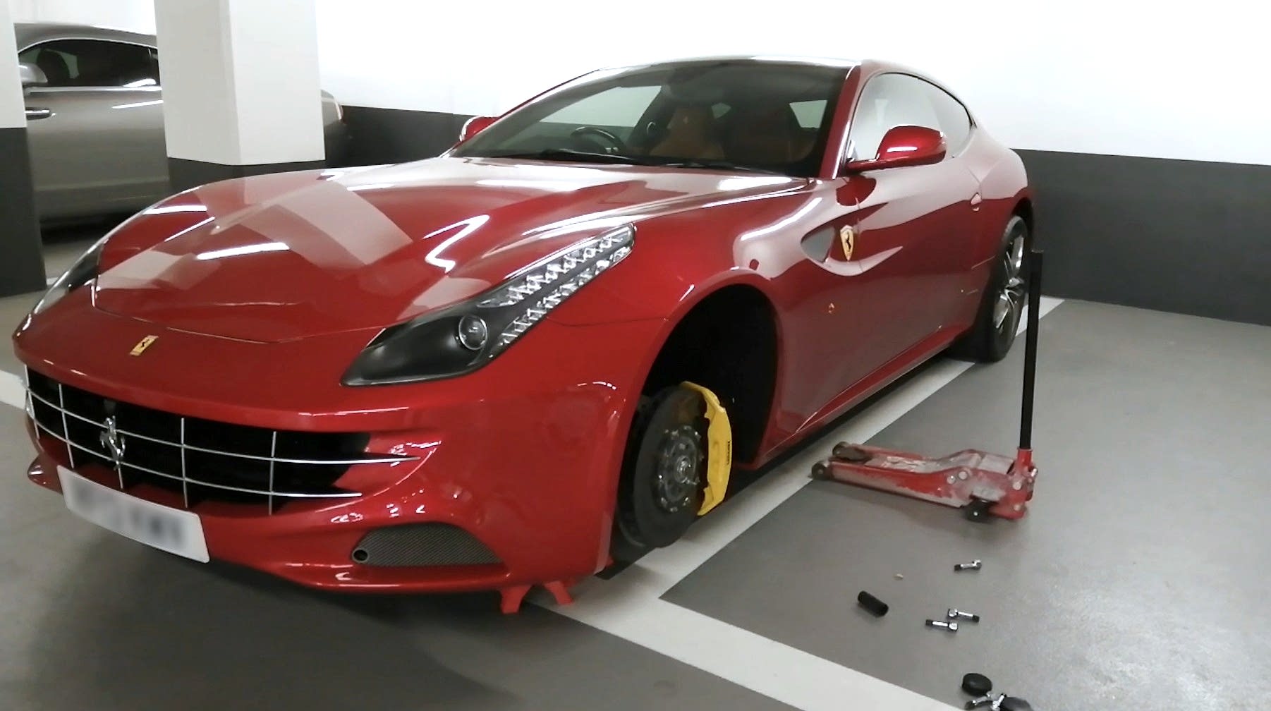 Alloy wheel being removed for repair